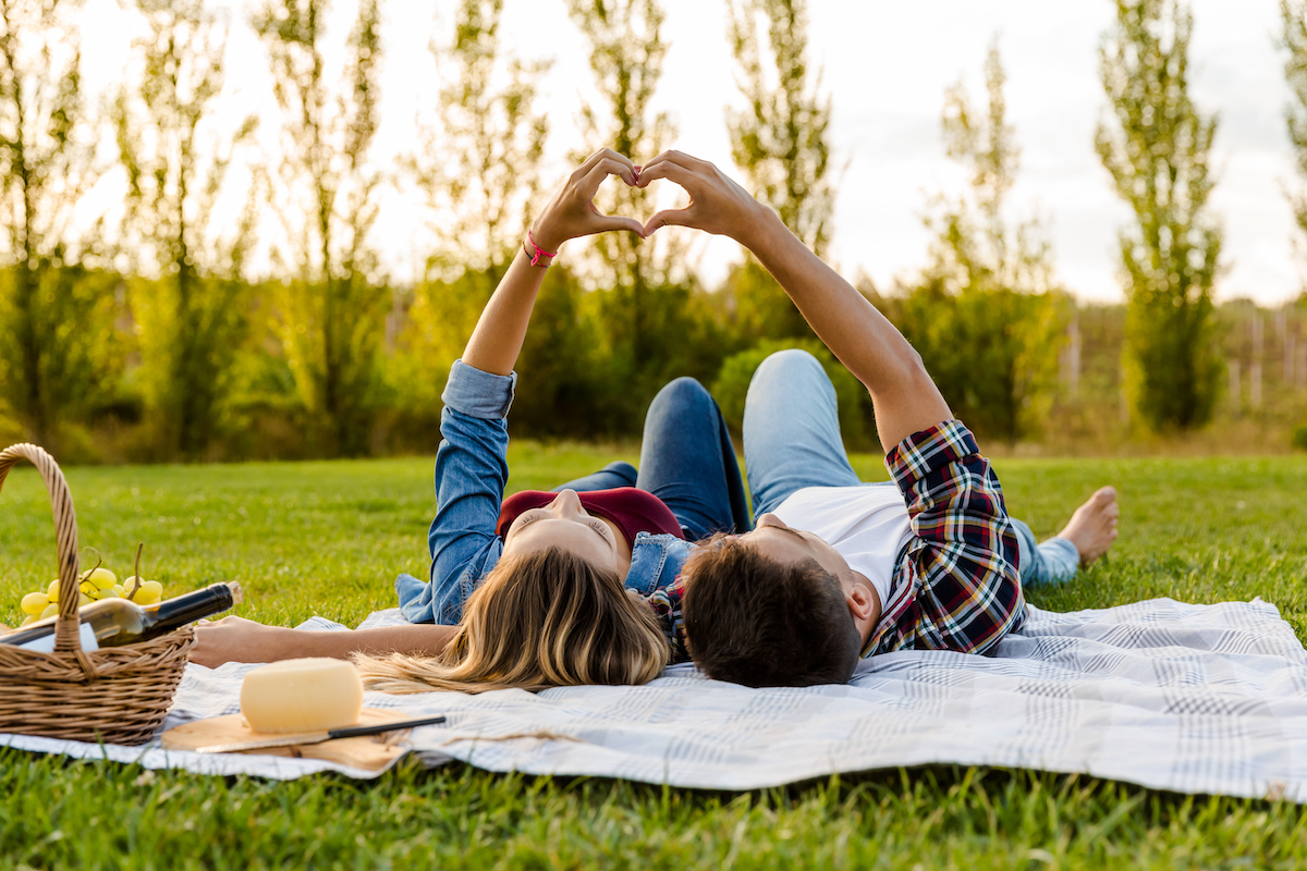 happy,couple,in,love,,lying,on,the,park,and,enjoying