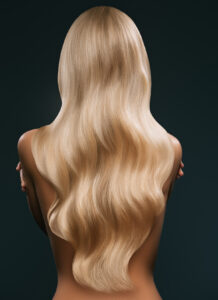 back,view,of,woman,with,long,blond,hair,,isolated,on
