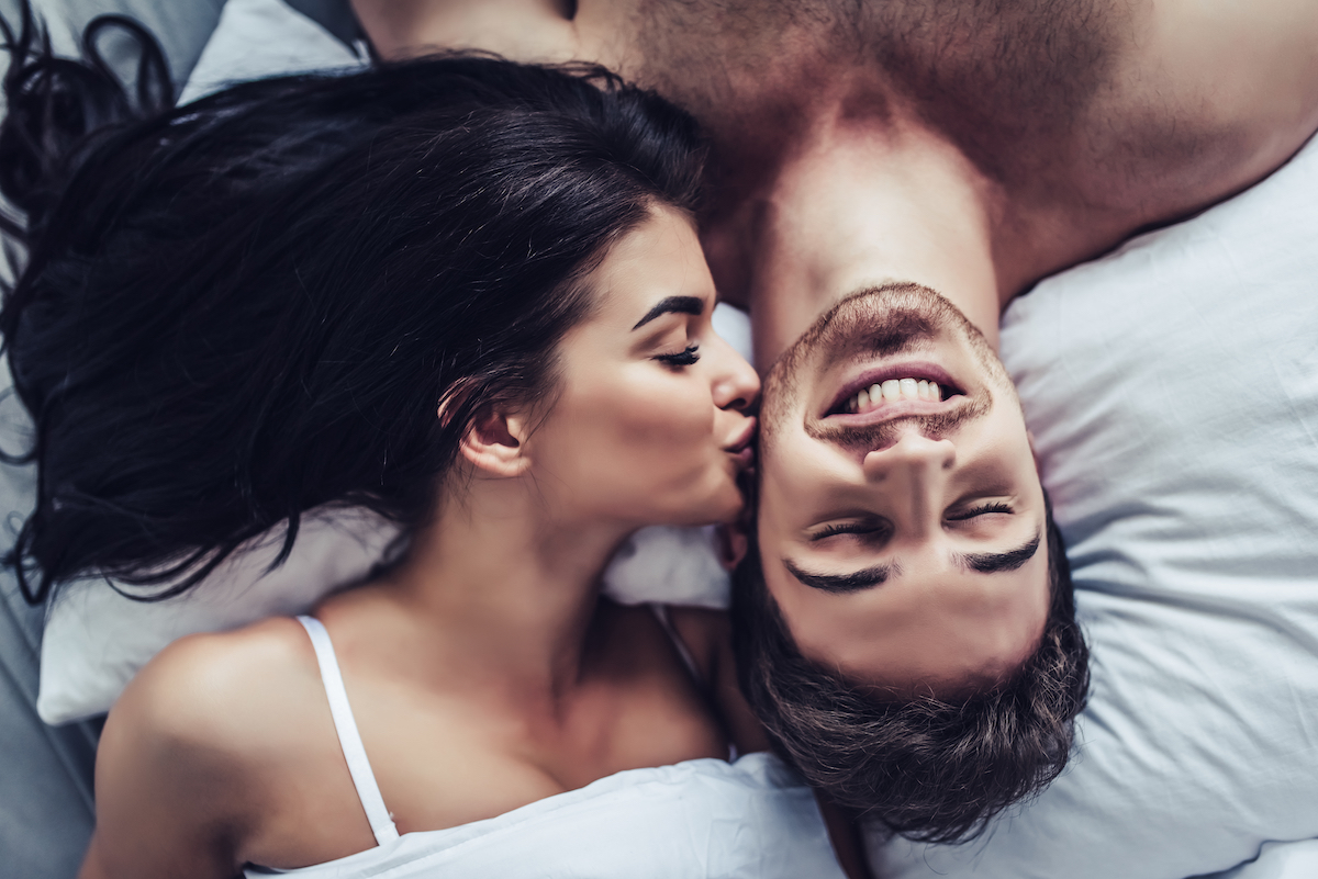 close up,of,happy,couple,is,lying,in,bed,together.,enjoying